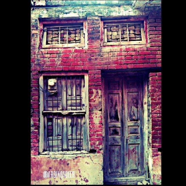 A very old door of an abandoned house